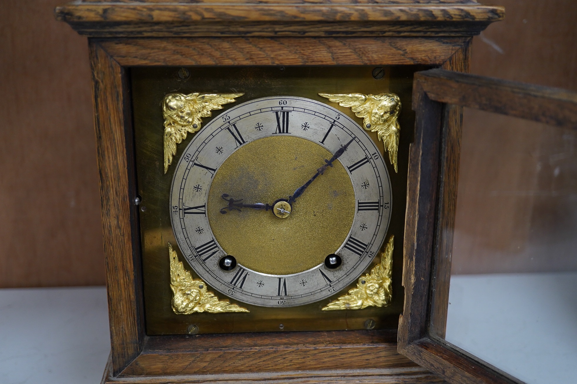 A late 19th century W&H oak cased mantel clock, chiming and striking on two coiled gongs, 27cm high. Condition - fair to good, missing the handle to the top